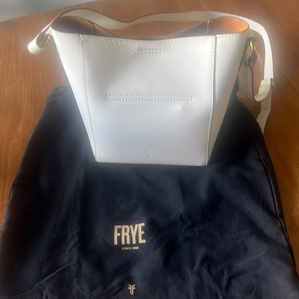 Frye Leather Crossbody Bucket-adjustable strap. Never used. Stored in cloth bag.